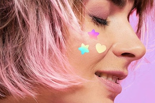 colorful pimple patches on a face