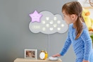Lifestyle image of a small child using the Fisher-Price Bedtime Sound Machine 