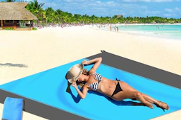 a woman using a beach mat
