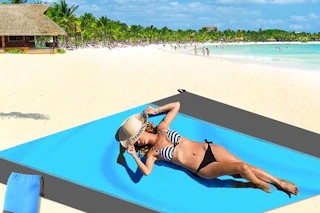a woman using a beach mat