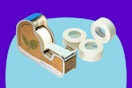 Masking Tape Dispenser with 4 Rolls on a blue background