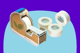 Masking Tape Dispenser with 4 Rolls on a blue background