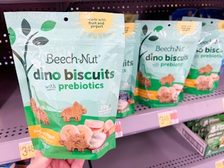 hand holding bag of Beech Nut dino biscuits