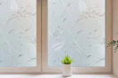 Lifestyle image of floral window privacy film installed on window in home