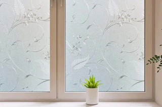 Lifestyle image of floral window privacy film installed on window in home
