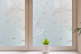 Lifestyle image of floral window privacy film installed on window in home