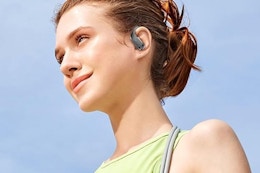 a woman wearing wireless earbuds