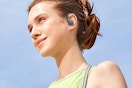 a woman wearing wireless earbuds