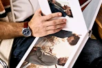 Close up shot of man looking at a Shutterfly photobook