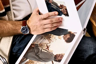Close up shot of man looking at a Shutterfly photobook