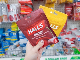 hand holding halls cough drops at dollar tree