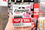 hand holding a pack of energizer batteries