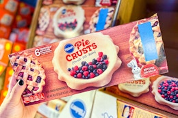 hand holding a pack of pillsbury pie crusts