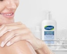 a person next to a bottle of body wash