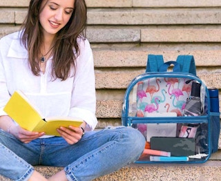 a woman next to a clear backpack