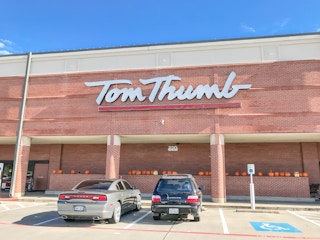 Tom Thumb grocery store, store front with cars parked in front.