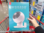 hand holding a woozoo fan in cart