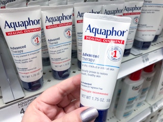 hand holding aquaphor healing ointment at target