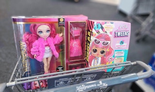 rainbow high and LOL doll inside shopping cart