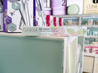 a mascara box on a sage and white table next to a store display