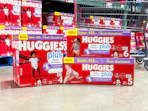 huggies diapers in front of cart in store floor
