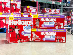 huggies diapers in front of cart in store floor