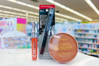 rimmel lip gloss eyeliner and bronzer on store counter