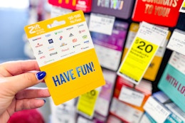 person holding a gift card