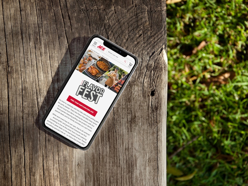 a phone showing the ace hardware flavor fest page with details about the 2023 labor day event
