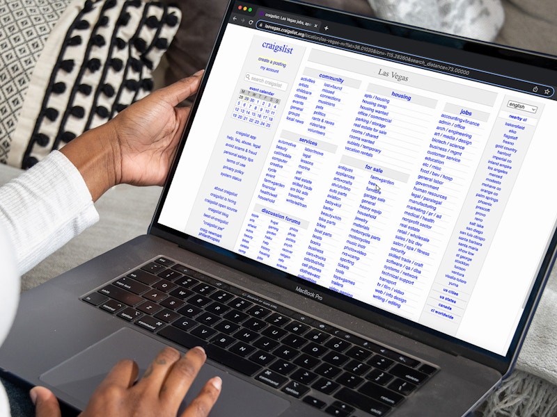 A person looking at the Craigslist homepage