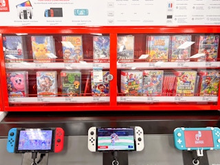a display of video games and nintendo switch consoles at target