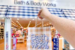 bath and body works bag being held up in front of store 