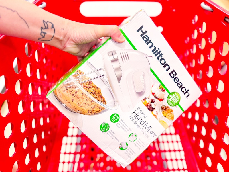 hand holding hamilton beach mixer over target cart