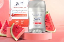 a stick of deodorant on display next to slices of watermelon 