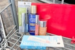 neutrogena mascara, lip mask, lip gloss, foundation, and makeup remover in a cart