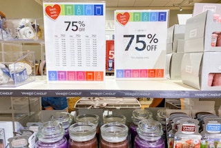 75% off signs on a shelf at Yankee candle