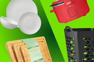 white dinnerware, wooden cutting boards, black laundry hamper, and red slow cooker