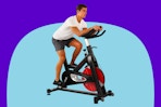 Man riding the Sunny Health & Fitness Stationary Exercise Bike.