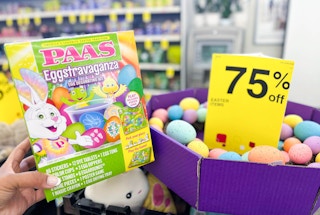 hand holding Easter egg decorating kit next to 75% off Easter clearance sign