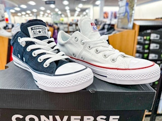 converse sneakers ontop of converse box in store
