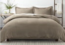 king-size taupe duvet set sitting on a bed