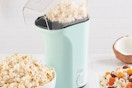 a dash popcorn maker on a table