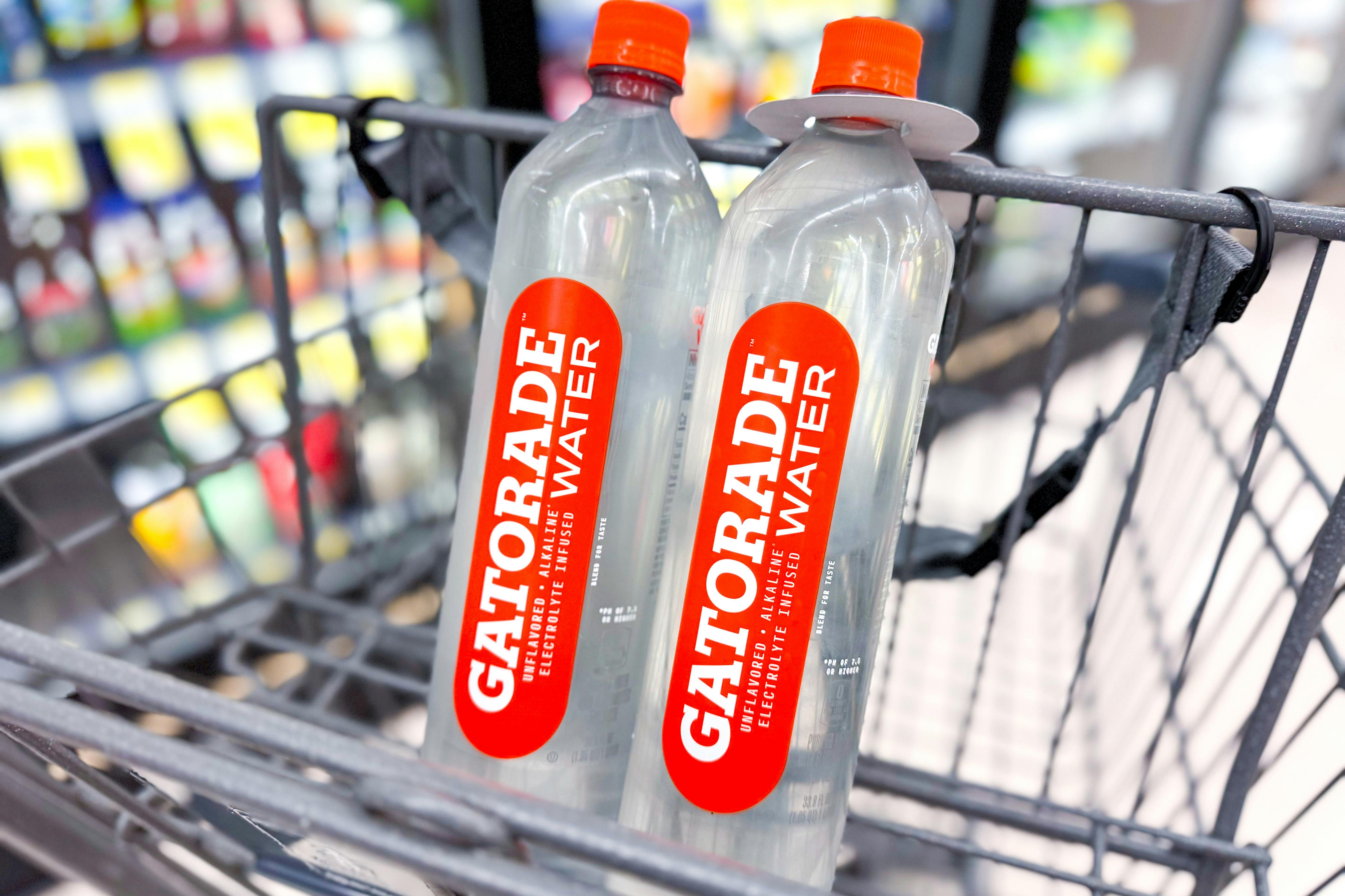 two bottles of water sitting in shopping cart