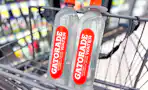 two bottles of water sitting in shopping cart