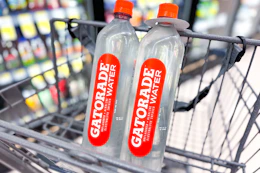 two bottles of water sitting in shopping cart