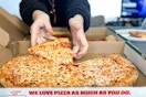 A person grabbing a slice of Papa John's Pizza from a pizza box.