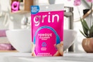 bag of tongue cleaners on bathroom counter