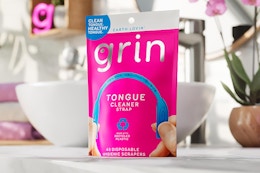 bag of tongue cleaners on bathroom counter