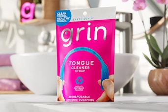 bag of tongue cleaners on bathroom counter