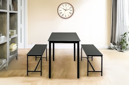 Lifestyle image of the Homestock 3-piece dining set (in the color black) 